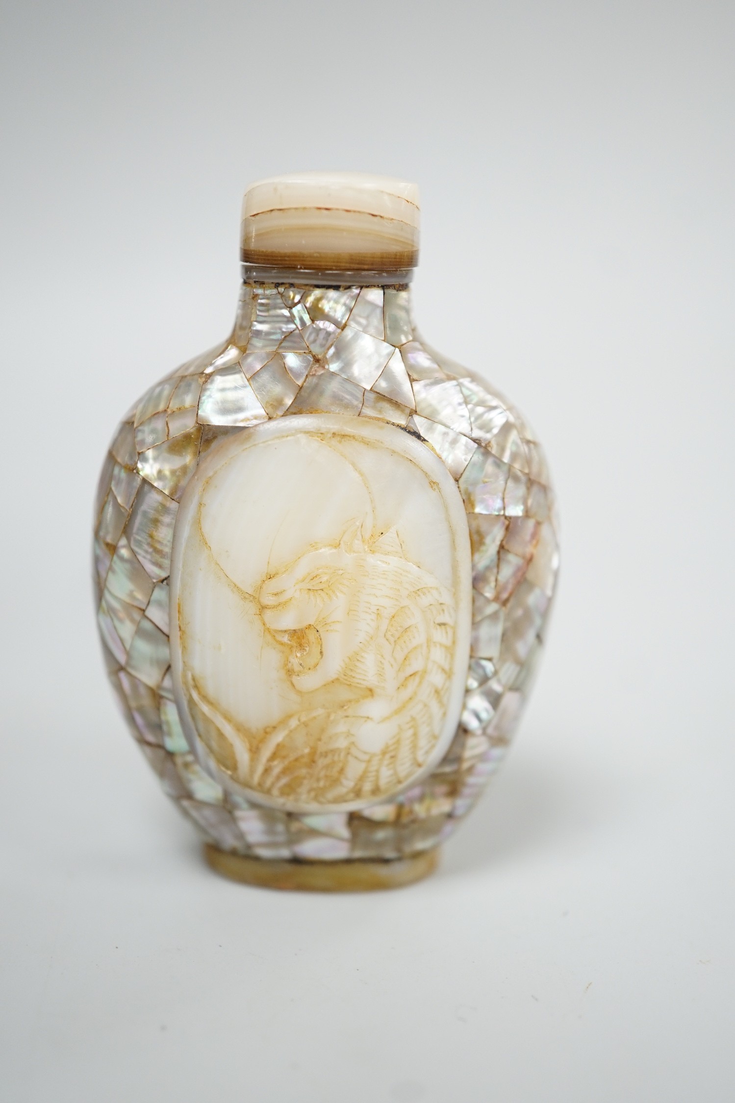 A Chinese shell and mother of pearl snuff bottle, Tongzhi mark probably later, 6.2 cm high including stopper